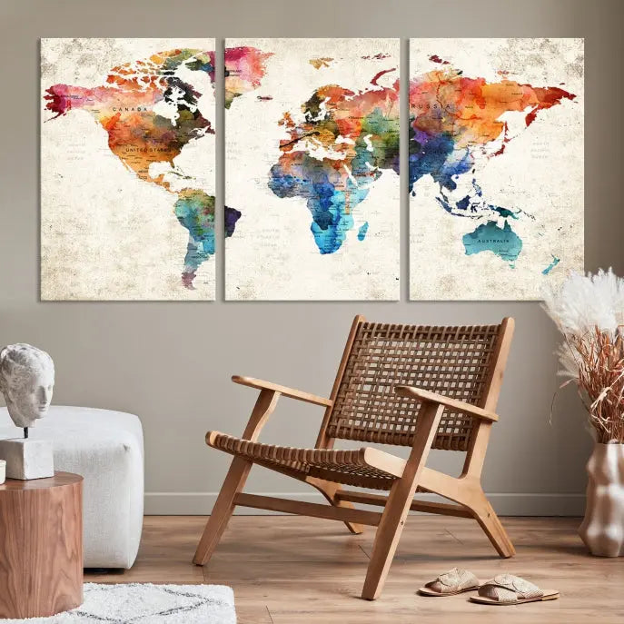 A Push Pin World Map Wall Art Canvas Print with a colorful abstract design and UV-protective coating is displayed on the wall.