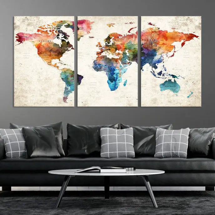 A Push Pin World Map Wall Art Canvas Print with a colorful abstract design and UV-protective coating is displayed on the wall.