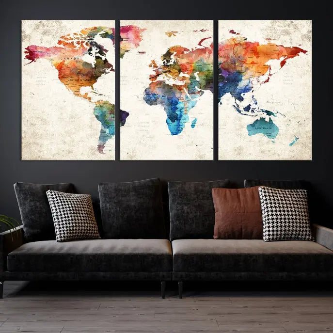 A Push Pin World Map Wall Art Canvas Print with a colorful abstract design and UV-protective coating is displayed on the wall.