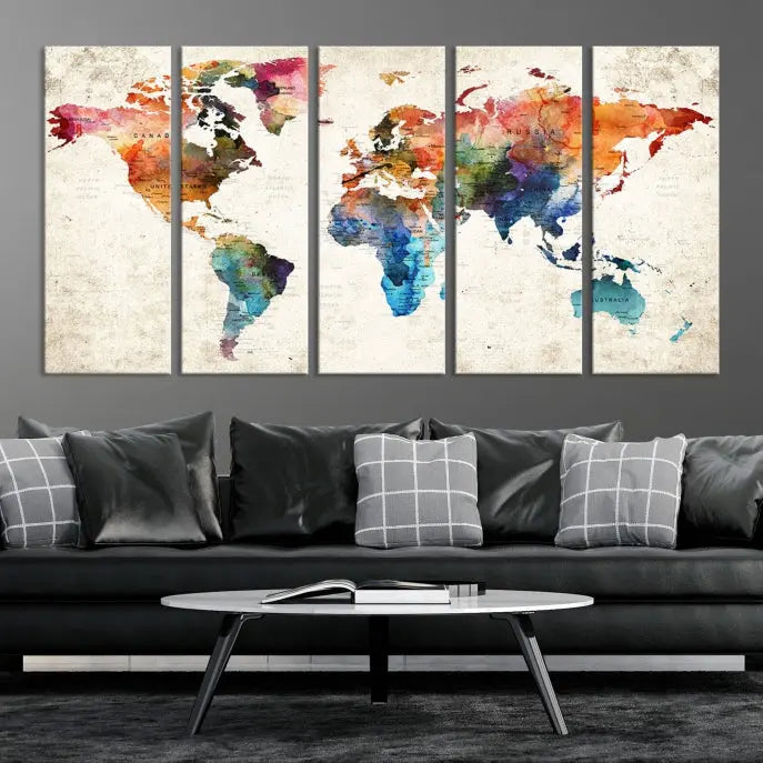 A Push Pin World Map Wall Art Canvas Print with a colorful abstract design and UV-protective coating is displayed on the wall.