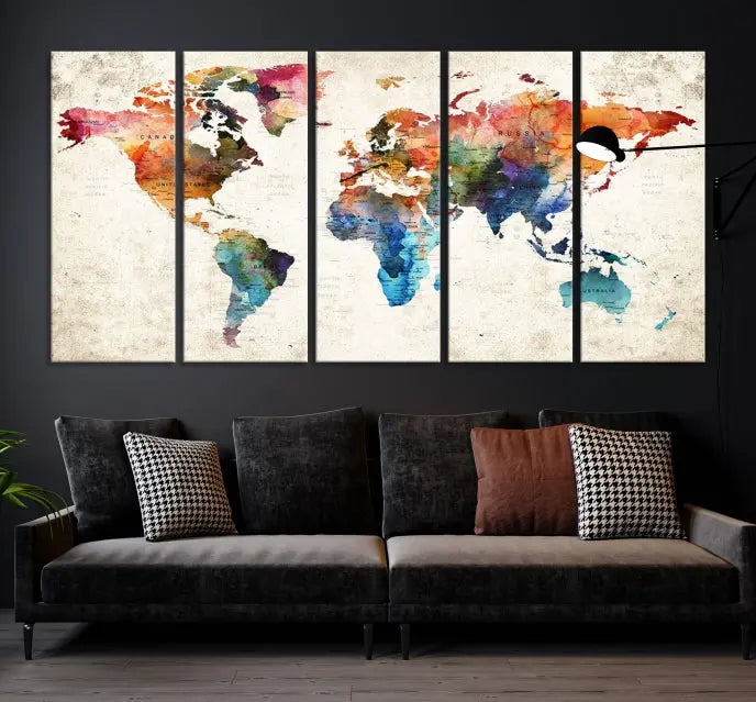 A Push Pin World Map Wall Art Canvas Print with a colorful abstract design and UV-protective coating is displayed on the wall.