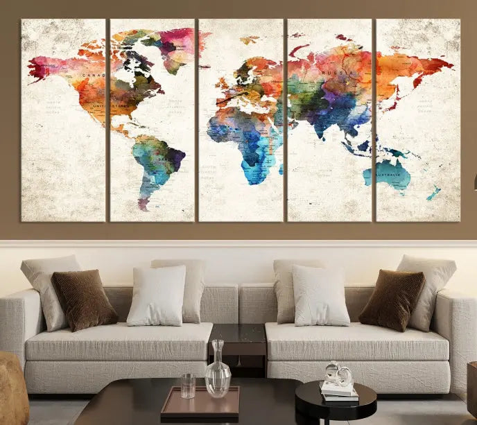 A Push Pin World Map Wall Art Canvas Print with a colorful abstract design and UV-protective coating is displayed on the wall.