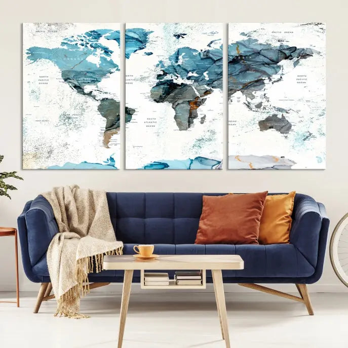 A modern living room showcases the Push Pin World Map Wall Art Canvas Print, crafted on museum-quality polycotton canvas, enhancing elegance and depth. The gallery-wrapped artwork creates an inviting space filled with charm.