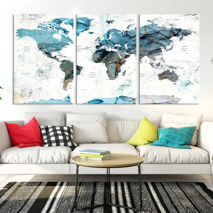 A modern living room showcases the Push Pin World Map Wall Art Canvas Print, crafted on museum-quality polycotton canvas, enhancing elegance and depth. The gallery-wrapped artwork creates an inviting space filled with charm.