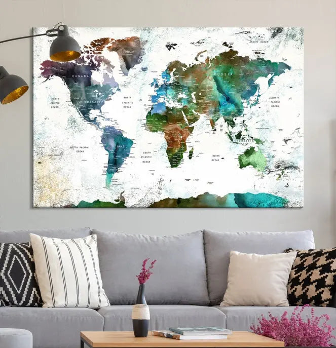 A Push Pin World Map Wall Art Canvas Print, featuring watercolor hues and enhanced with a UV-protective coating for long-lasting vibrant colors, hangs prominently.