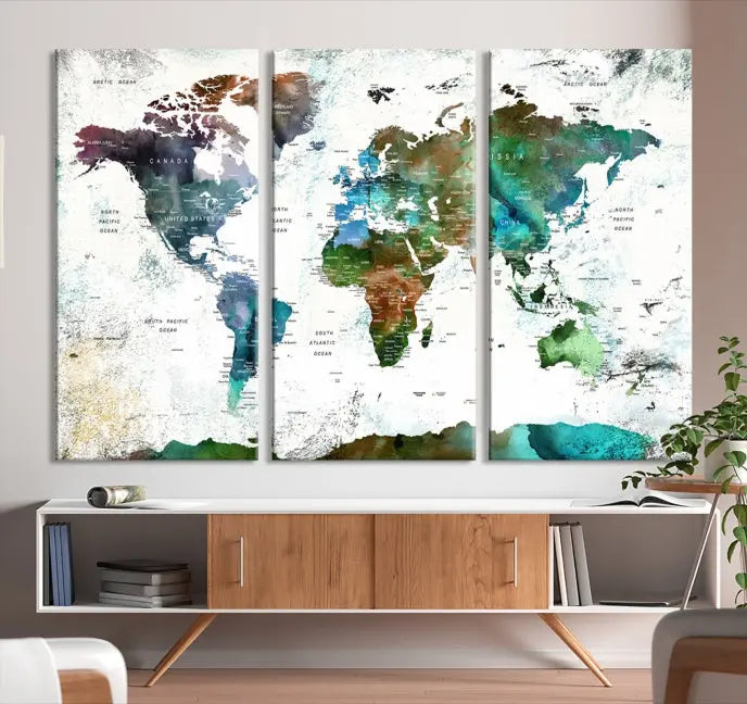 A Push Pin World Map Wall Art Canvas Print, featuring watercolor hues and enhanced with a UV-protective coating for long-lasting vibrant colors, hangs prominently.