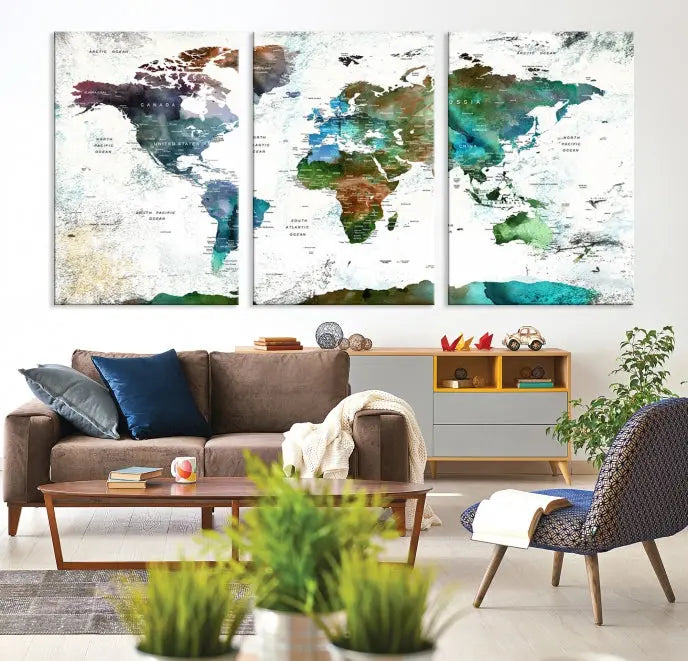 A Push Pin World Map Wall Art Canvas Print, featuring watercolor hues and enhanced with a UV-protective coating for long-lasting vibrant colors, hangs prominently.