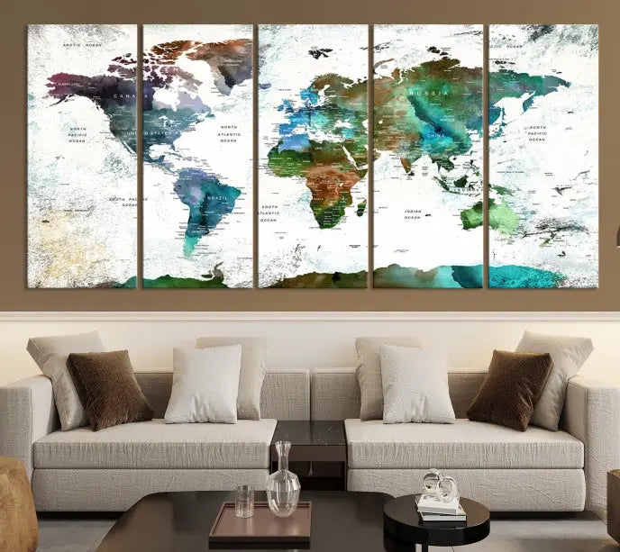 A Push Pin World Map Wall Art Canvas Print, featuring watercolor hues and enhanced with a UV-protective coating for long-lasting vibrant colors, hangs prominently.