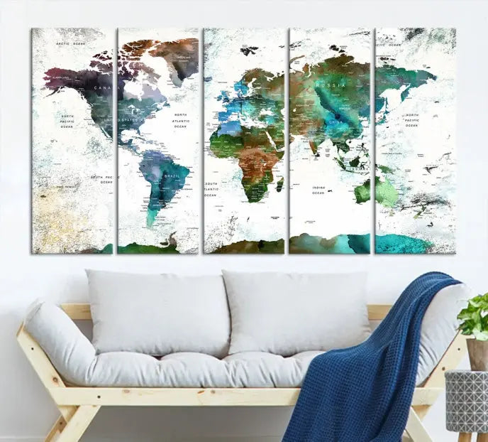 A Push Pin World Map Wall Art Canvas Print, featuring watercolor hues and enhanced with a UV-protective coating for long-lasting vibrant colors, hangs prominently.