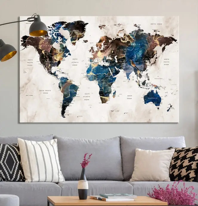 A vibrant Push Pin World Map Wall Art Watercolor Painting Canvas Print, expertly hand-assembled with museum-quality polycotton and UV-protective coating, is displayed in a modern living room.