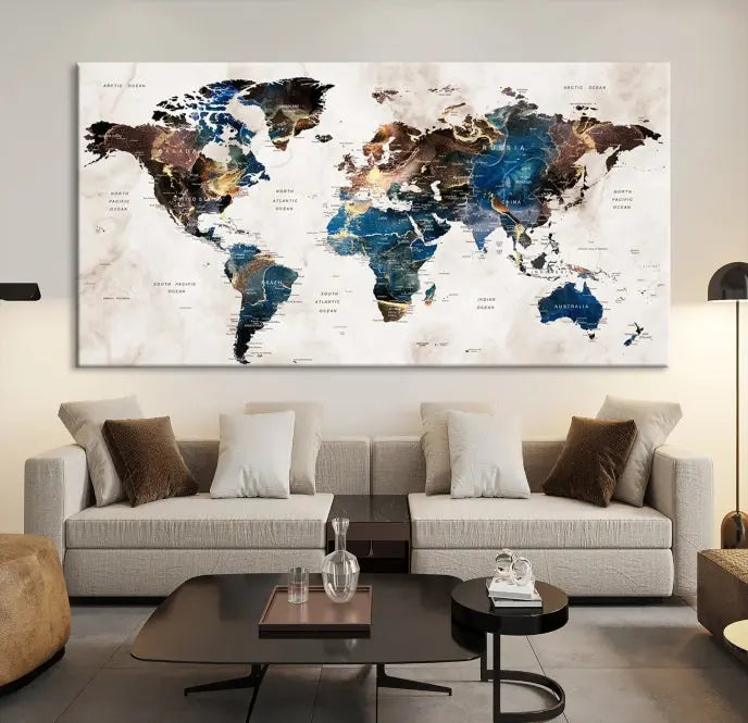 A vibrant Push Pin World Map Wall Art Watercolor Painting Canvas Print, expertly hand-assembled with museum-quality polycotton and UV-protective coating, is displayed in a modern living room.