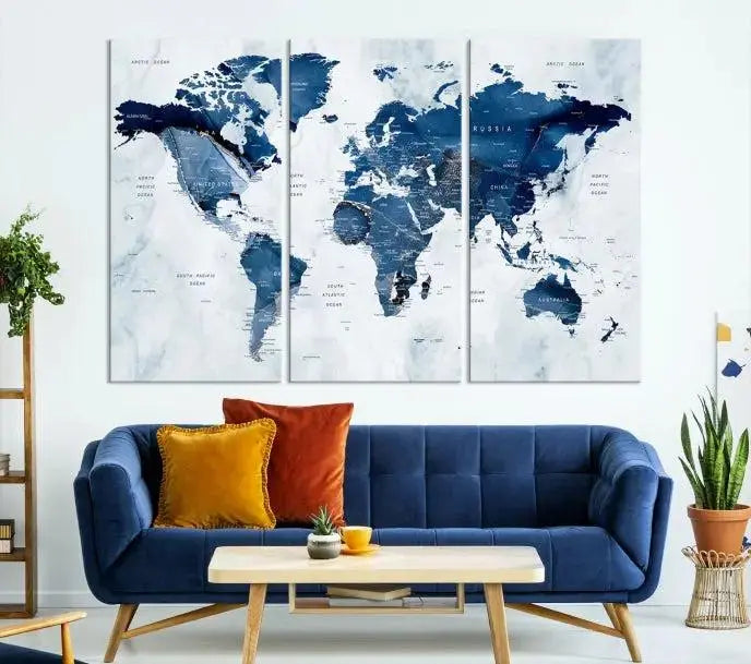 A Push Pin World Map Watercolor Wall Art Canvas Print in shades of blue and white is displayed.