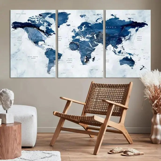 A Push Pin World Map Watercolor Wall Art Canvas Print in shades of blue and white is displayed.