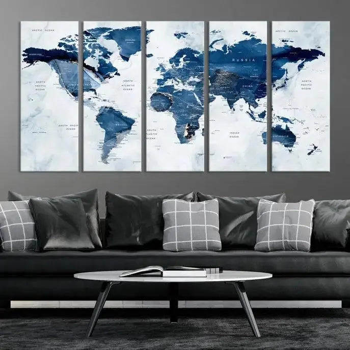 A Push Pin World Map Watercolor Wall Art Canvas Print in shades of blue and white is displayed.