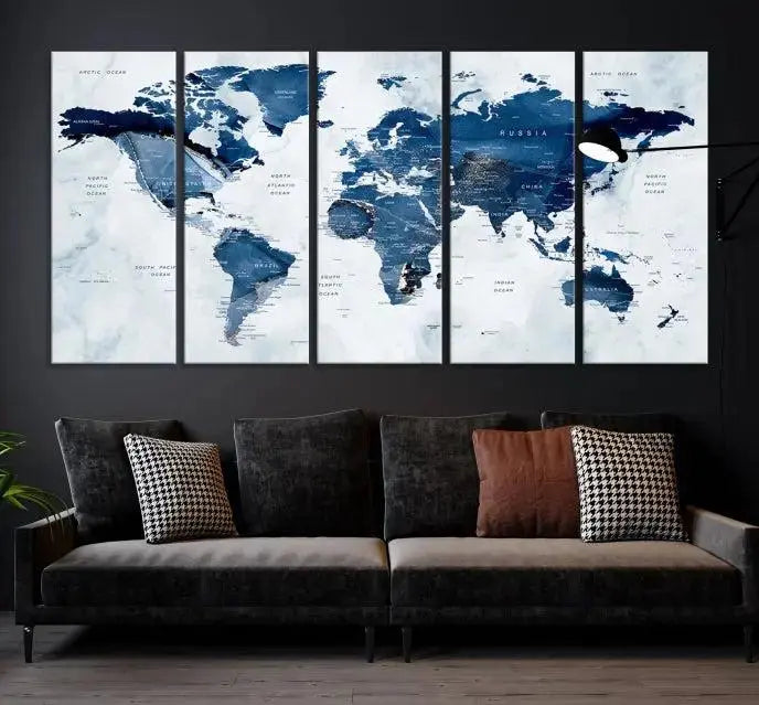 A Push Pin World Map Watercolor Wall Art Canvas Print in shades of blue and white is displayed.