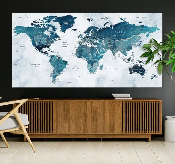 The Push Pin World Map Watercolor Wall Art Canvas Print, designed in soothing shades of blue and printed on museum-quality canvas with a UV-protective coating, elegantly hangs as a stunning piece. Enjoy free shipping on this artwork.