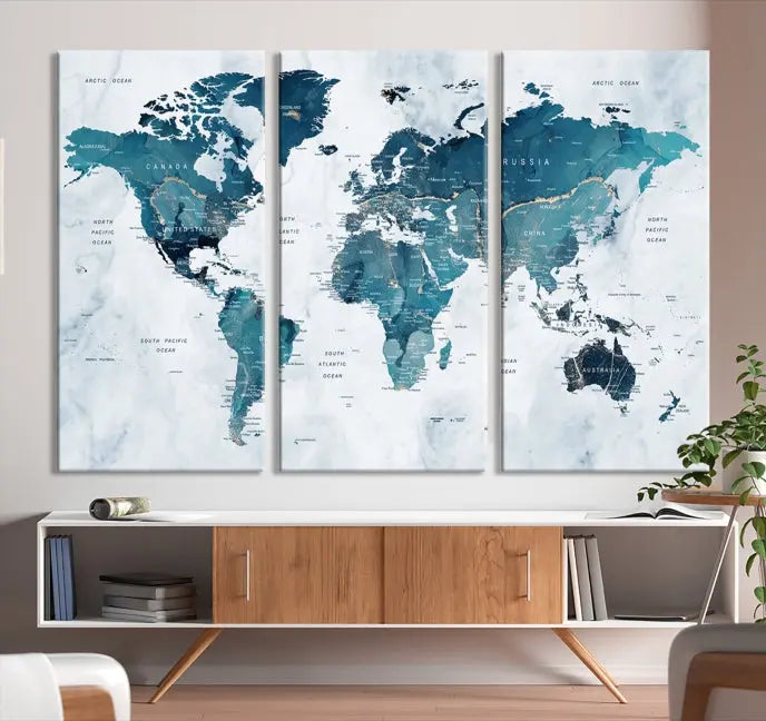 The Push Pin World Map Watercolor Wall Art Canvas Print, designed in soothing shades of blue and printed on museum-quality canvas with a UV-protective coating, elegantly hangs as a stunning piece. Enjoy free shipping on this artwork.