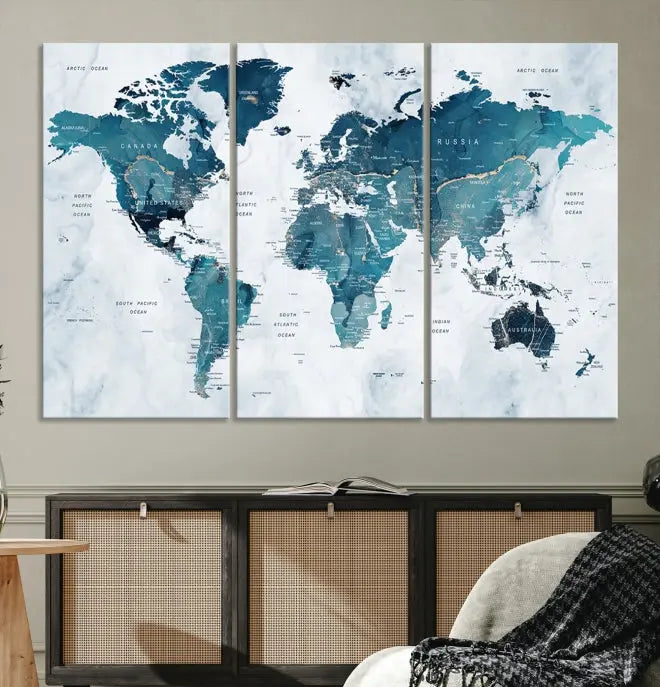 The Push Pin World Map Watercolor Wall Art Canvas Print, designed in soothing shades of blue and printed on museum-quality canvas with a UV-protective coating, elegantly hangs as a stunning piece. Enjoy free shipping on this artwork.