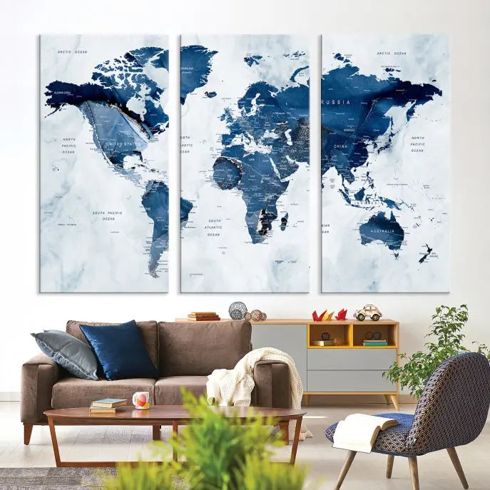 A Push Pin World Map Watercolor Wall Art Canvas Print in shades of blue and white is displayed.