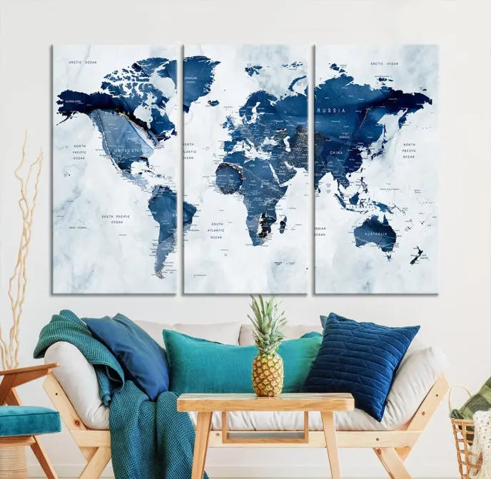 A Push Pin World Map Watercolor Wall Art Canvas Print in shades of blue and white is displayed.