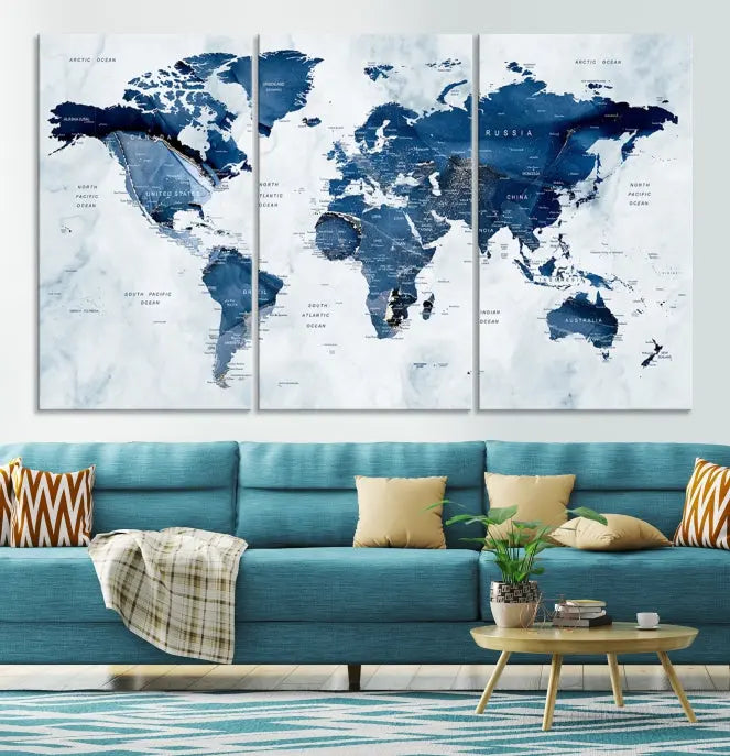 A Push Pin World Map Watercolor Wall Art Canvas Print in shades of blue and white is displayed.