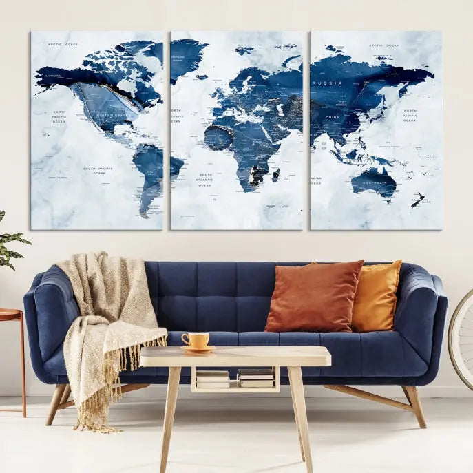 A Push Pin World Map Watercolor Wall Art Canvas Print in shades of blue and white is displayed.