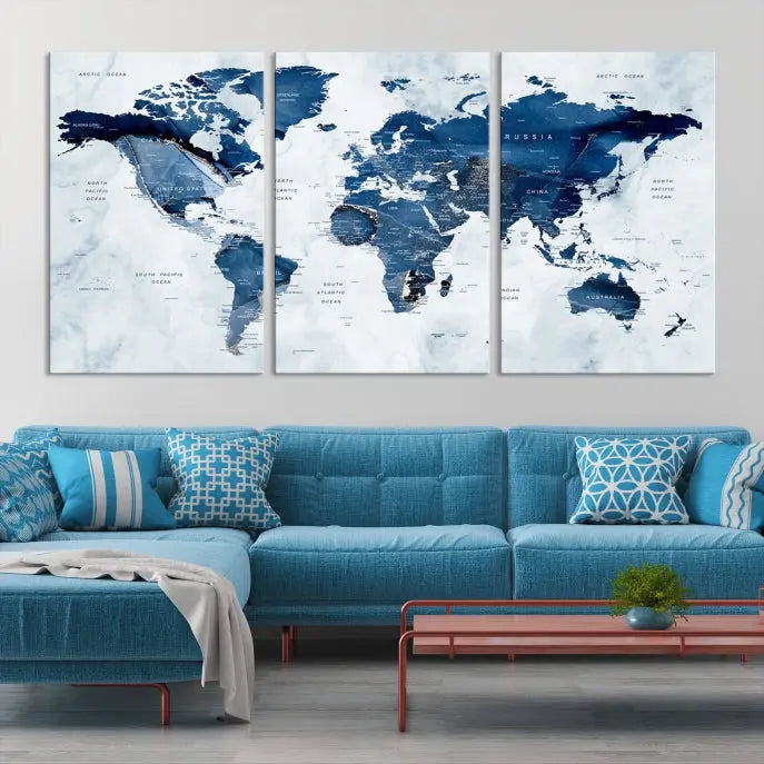 A Push Pin World Map Watercolor Wall Art Canvas Print in shades of blue and white is displayed.