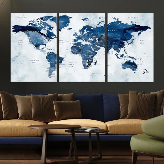 A Push Pin World Map Watercolor Wall Art Canvas Print in shades of blue and white is displayed.