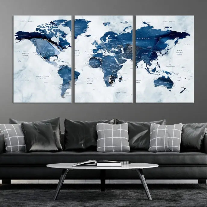 A Push Pin World Map Watercolor Wall Art Canvas Print in shades of blue and white is displayed.