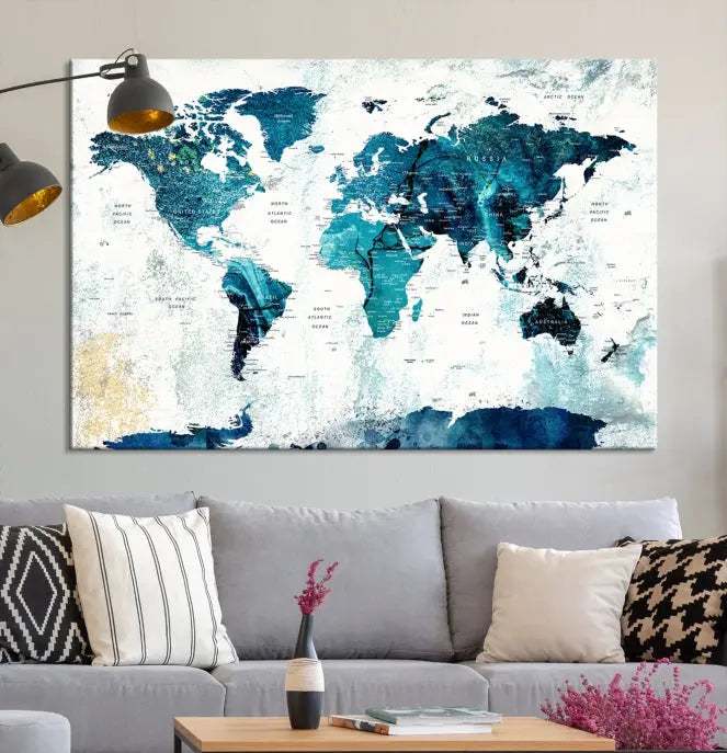 A modern living room showcases a Push Pin World Map with Antarctica, elegantly displayed on museum-quality canvas.