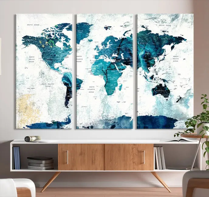 A modern living room showcases a Push Pin World Map with Antarctica, elegantly displayed on museum-quality canvas.