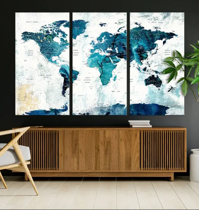 A modern living room showcases a Push Pin World Map with Antarctica, elegantly displayed on museum-quality canvas.