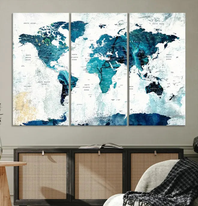 A modern living room showcases a Push Pin World Map with Antarctica, elegantly displayed on museum-quality canvas.