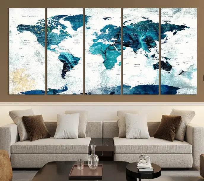 A modern living room showcases a Push Pin World Map with Antarctica, elegantly displayed on museum-quality canvas.