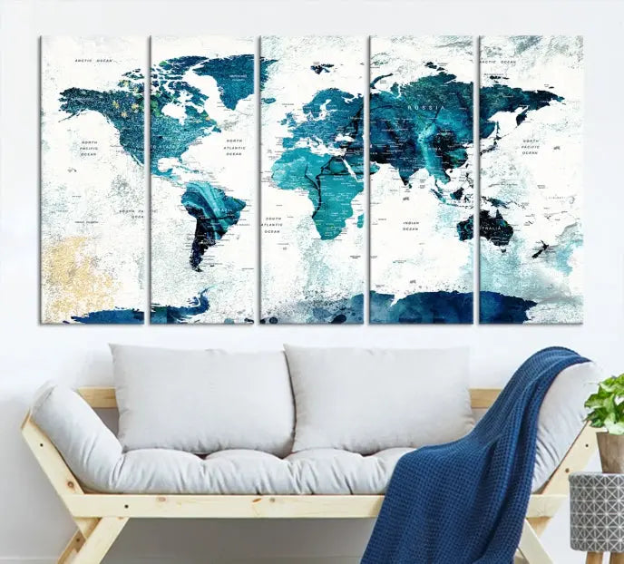 A modern living room showcases a Push Pin World Map with Antarctica, elegantly displayed on museum-quality canvas.