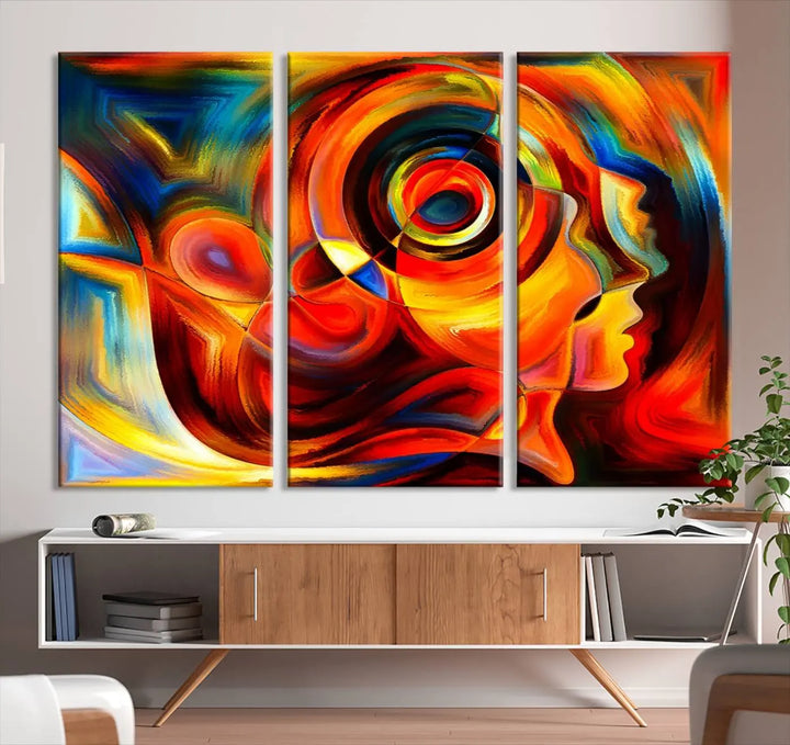 The "Radiant Colors Human Figures" wall art canvas print enhances the space with its vibrant abstract panels, showcasing swirling colors and dynamic shapes. The gallery-wrapped artwork is crafted from museum-quality polycotton and features a UV-protective coating, ensuring lasting beauty and elegance.