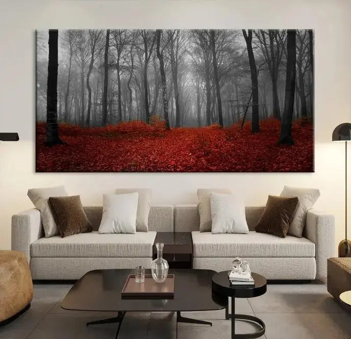 The Red Forest Floor Canvas Wall Art, a mystical foggy woodland triptych, is elegantly displayed on the wall. This nature-inspired decor transforms your space into an enchanting retreat.