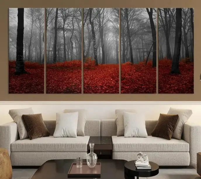 The Red Forest Floor Canvas Wall Art, a mystical foggy woodland triptych, is elegantly displayed on the wall. This nature-inspired decor transforms your space into an enchanting retreat.