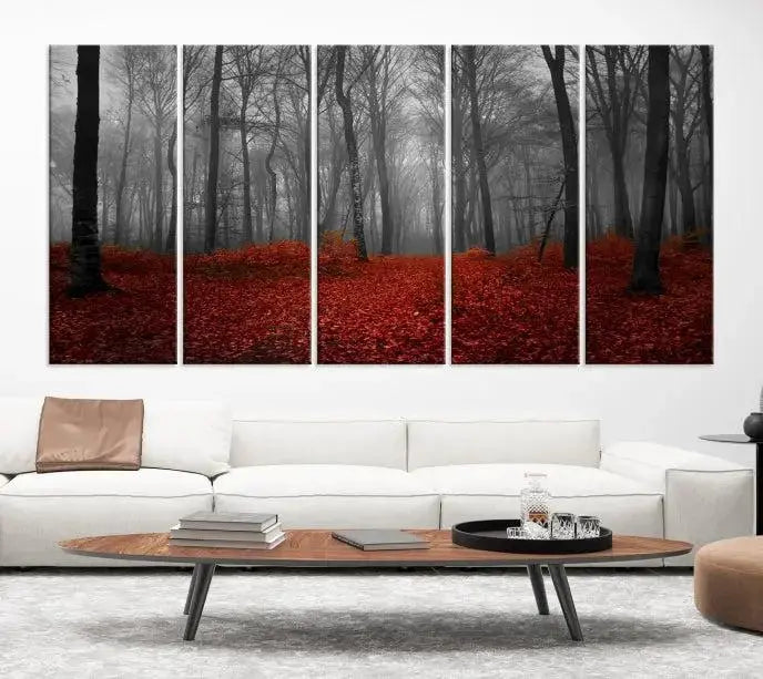 The Red Forest Floor Canvas Wall Art, a mystical foggy woodland triptych, is elegantly displayed on the wall. This nature-inspired decor transforms your space into an enchanting retreat.