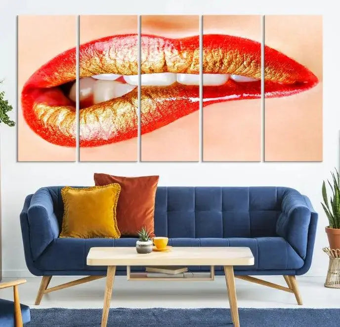 The Red Lip Bite Canvas Print, featuring a triptych of lips with red and gold lipstick, is elegantly displayed, enhancing the modern aesthetic of the minimalist room decor. This artwork is printed on high-quality polycotton canvas.