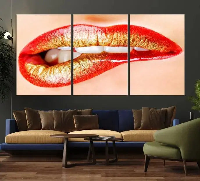 The Red Lip Bite Canvas Print, featuring a triptych of lips with red and gold lipstick, is elegantly displayed, enhancing the modern aesthetic of the minimalist room decor. This artwork is printed on high-quality polycotton canvas.