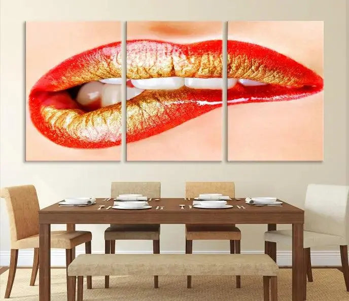 The Red Lip Bite Canvas Print, featuring a triptych of lips with red and gold lipstick, is elegantly displayed, enhancing the modern aesthetic of the minimalist room decor. This artwork is printed on high-quality polycotton canvas.