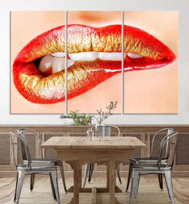 The Red Lip Bite Canvas Print, featuring a triptych of lips with red and gold lipstick, is elegantly displayed, enhancing the modern aesthetic of the minimalist room decor. This artwork is printed on high-quality polycotton canvas.