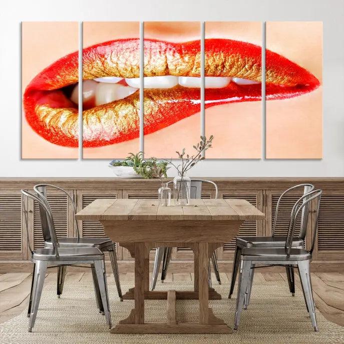 The Red Lip Bite Canvas Print, featuring a triptych of lips with red and gold lipstick, is elegantly displayed, enhancing the modern aesthetic of the minimalist room decor. This artwork is printed on high-quality polycotton canvas.