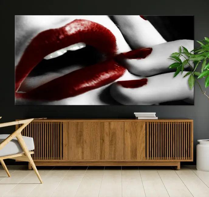 The wall features a black and white photo titled "Red Lips and Women Canvas Print," adding a touch of bold elegance to the room's contemporary art collection.