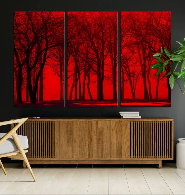 The "Red Sky and Forest Wall Art Print Triptych Canvas Print," with its striking silhouette of trees set against a vibrant red backdrop, adds a touch of elegance to any room. Enjoy this hand-assembled canvas masterpiece with free shipping.