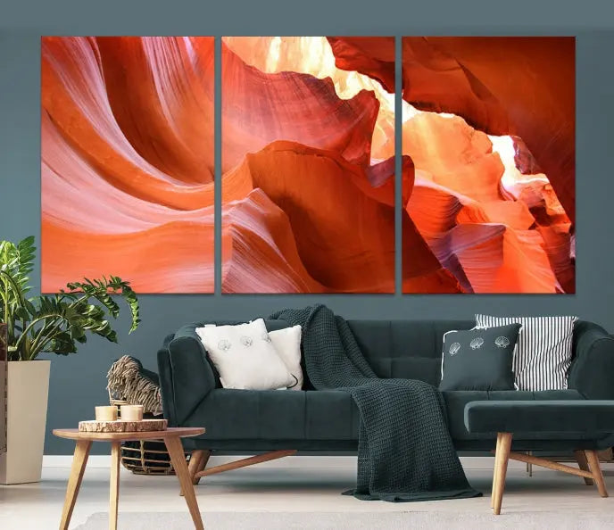 A triptych of Red Wave Shape Rock Form Antilop Canvas Wall Art, printed on museum-quality canvas, adorns the wall.