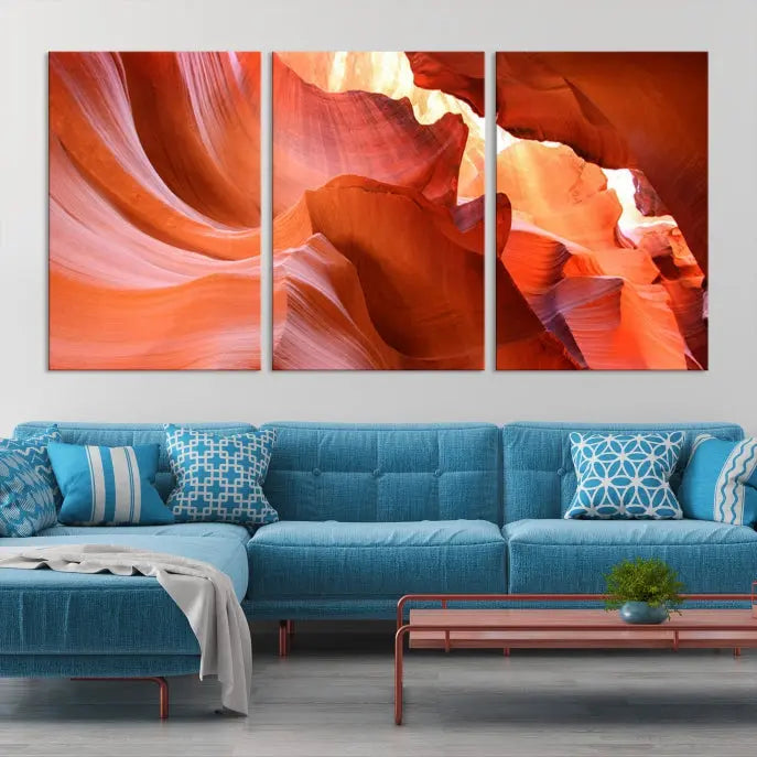 A triptych of Red Wave Shape Rock Form Antilop Canvas Wall Art, printed on museum-quality canvas, adorns the wall.