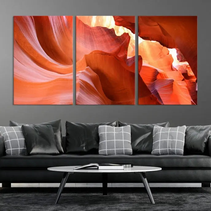 A triptych of Red Wave Shape Rock Form Antilop Canvas Wall Art, printed on museum-quality canvas, adorns the wall.