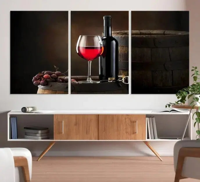 The wall art triptych on museum-quality canvas features the Red Wine and Bottle Canvas Print, showcasing wine, a glass, grapes, and barrels. The gallery-wrapped pieces ensure elegance while the UV-protective coating preserves their vibrant charm.